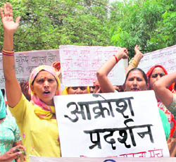 Members of the All-India Parents Association stage a demonstration against fee hike in private schools in Gurgaon on Monday.