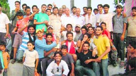 Winners of the Friends Cricket Tournament receive prizes at Ahmedgarh