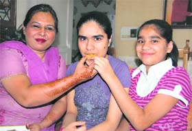 Shagun Chahal, who got 23rd rank in PMT examination, with her family in Ludhiana