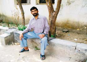 Ramesh Kumar chained to a tree in the police post of Naushera Majha Singh in Gurdaspur district