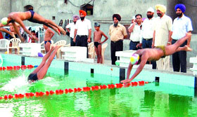 A swimming event going on at the pool.