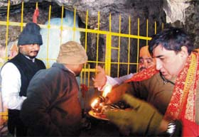 Pratham pujan being performed at the holy cave shrine of Amarnath by the Additional CEO and the camp director of the shrine board before the holy cave was opened to the pilgrims for darshan on Tuesday morning