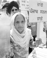 Residents stage a protest againt inadequate water supply at Phase XI in Mohali on Wednesday.