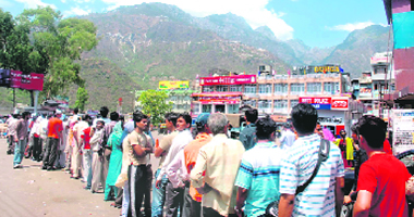 Pilgrims queue up outside the Katra registration counter for yatra slips to pay obeisance at Mata Vaishno Devi on Wednesday.