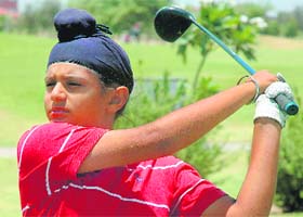 A player goes for a drive on the greens of the Panchkula Golf Club to lead in the Category D of the Lalit Suri Northern India Junior Golf Championship in Panchkula
