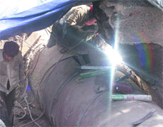 Workers repair the pipeline