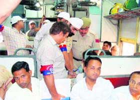 GRP personnel and rail wardens carry out a checking on a train in Jagadhri