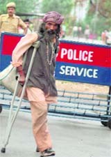 A physically challenged pilgrim on his way for registration at the Bhagwati Nagar base camp in Jammu on Thursday.