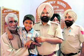 Ajay, who was reuinited with his parents by the Kotawali police, in Ludhiana on Thursday.
