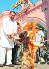 Activists of the Punjab Pradesh Congress Committee burn an effigy of UP Chief Minister Mayawati at Amritsar on Thursday.