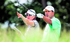 Jeev Milkha Singh with his caddie Jan Squirg during the third day of previews to the U.S. Open at Bethpage State Park on Wednesday.