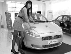 A model displays Fiat’s new model ‘Grande Punto’ in Mohali on Friday.