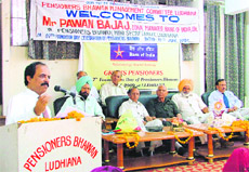 Pawan Bajaj, zonal manager, Bank of India, addresses a gathering during the foundation day of Pensioners Bhawan in Ludhiana on Friday.