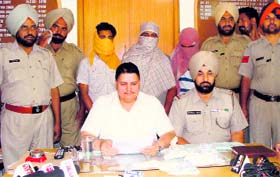 The snatchers in police custody at Raikot.