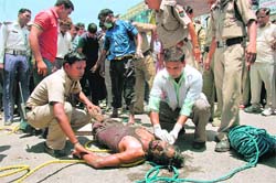  Sewerman Pramod who was pulled out of a manhole near Ashley Hall in Dehradun on Friday. He was rescued but his colleague Ashish was asphyxiated while cleaning the sewer. 