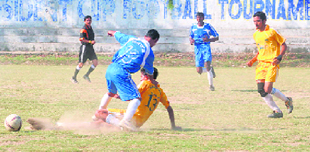 A match in progress at the Dehradun Football League on Sunday.