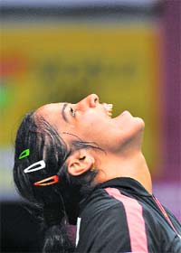 Saina Nehwal reacts after defeating Chinas Lin Wang in the womens singles final at the Indonesian Open 2009 badminton competition in Jakarta on Sunday. With a stunning victory over her higher-ranked opponent, the ace shuttler scripted history by becoming the first Indian to win a Super Series tournament.