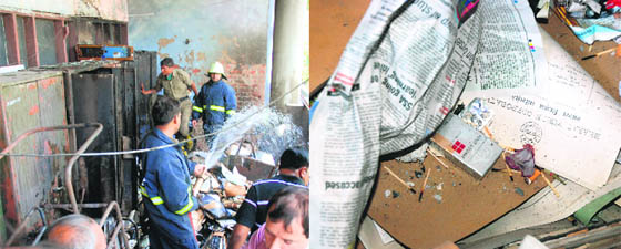 Firemen douse the blaze at the information and public relations department, Haryana, in Sector 17, Chandigarh, on Monday; and (right) Empty cigarette packets, cigarette butts and matchsticks lie amidst waste papers.