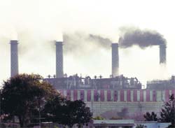 Ash being puffed out of chimneys of the thermal power station in Bathinda. 