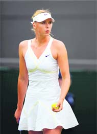 Maria Sharapova prepares to serve against Viktoriya Kutuzova during her first round match on Monday.