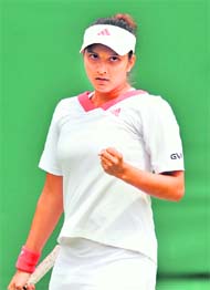 Sania Mirza reacts after winning a point against Anna-Lena Groenefeld during their first round match on Monday. 