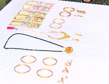 Gold ornaments and cash recovered by the police in Jammu.