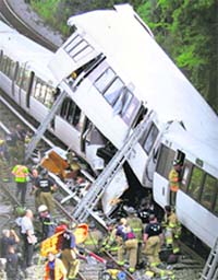 Fire and emergency workers at the site of a rush-hour 