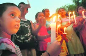 Contractual teachers and their children take out a candlelight procession to support their demands at Sector 17 in Chandigarh