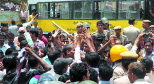 Residents of Sangam Vihar in south Delhi protest against poor quality of drinking water.