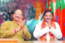 Ramesh Pokhriyal Nishank (R) and BC Khanduri at a press conference at the BJP headquarters in New Delhi