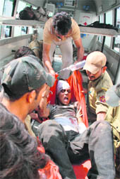An injured passenger being shifted to Jammus GMC hospital. 