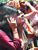 Admission seekers check out the first cut-off list at Hindu College in New Delhi on Thursday.