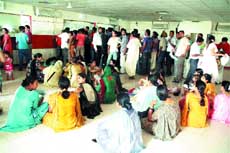 Applicants at the air-tight passport office in Jalandhar sweat out in the absence of power supply.