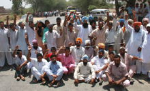Farmers blocking the Bathinda-Goniana road on Friday demanding adequate power supply during the ongoing paddy transplantation season.