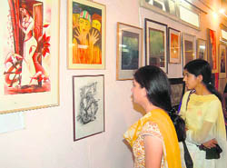 Visitors at the art exhibition in Dehradun on Friday.