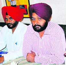 President of the Panchayat Association, Punjab, Sukhdev Singh (left) with another office-bearer at a press conference in Chandigarh on Friday.