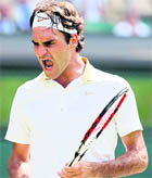 Roger Federer gestures during his match against Philipp Kohlschreiber on Friday. Federer won 6-3 6-2 6-7 6-1.