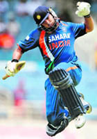Yuvraj Singh celebrates after completing his century on Friday.