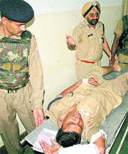 An injured CRPF jawan being taken to hospital in Srinagar on Saturday. 