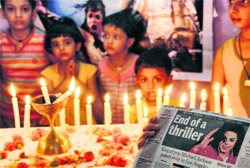 Students of the Michael Jackson Institute of Dance light candles to mourn the death of the pop star in Jammu on Saturday. 