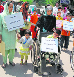 Special children hold a protest in support of their demands in Srinagar on Saturday. 