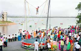 People enjoy boating and bungee jumping at Sukhna Lake on Sunday evening.