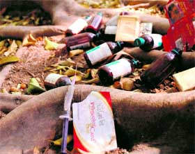 Bottles of cough syrups and syringes strewn at the parking lot along the boundary wall of Leisure Valley, Sector 10.