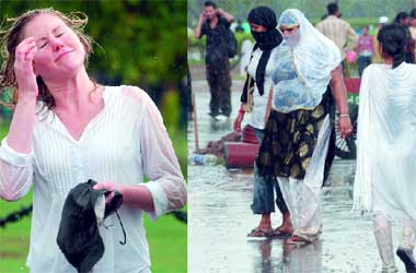 Delhiites welcome the showers at India Gate on Sunday.