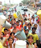 Residents hold a protest against water and power shortage on the Kaithal road in Karnal on Sunday.
