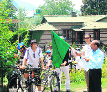 Manali SDM Rajeshwer Goel flags off a cycle rally to promote carbon-free tourism in Manali on Sunday.