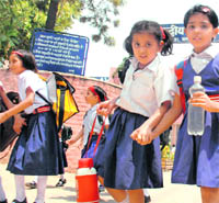 Kids come out from Kendriya Vidyalaya, Sector 31, Chandigarh, on Monday.