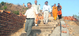 BH Patil, a former senior scientist of ISRO, near Jayanti Mata hill top in Kangra town along with participants of a yoga camp on Sunday.