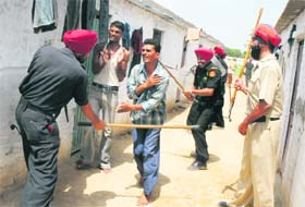 Migrant labourers being lathicharged near the Guru Gobind Singh refinery in Bathinda