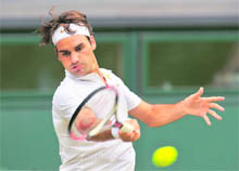 Roger Federer plays a shot against Robin Soderling on Monday.